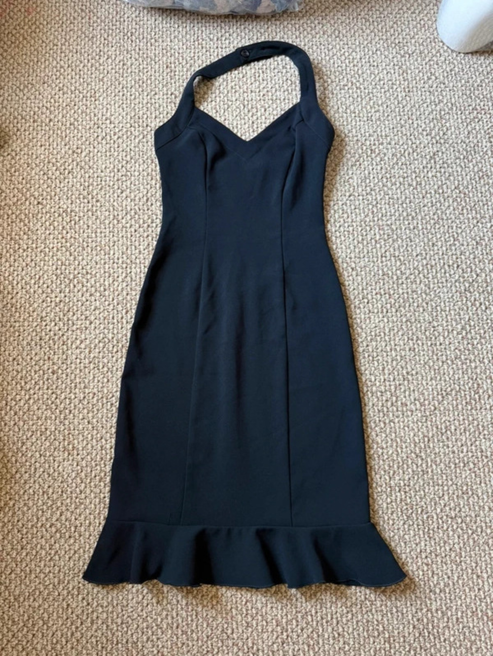black halter neck dress with ruffle hem
